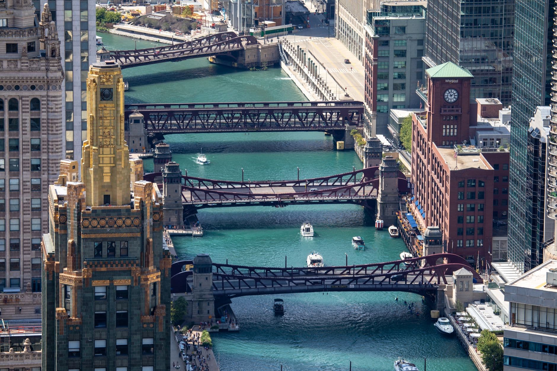 A stunning aerial view of Chicago's iconic bridges over the vibrant river canal.
